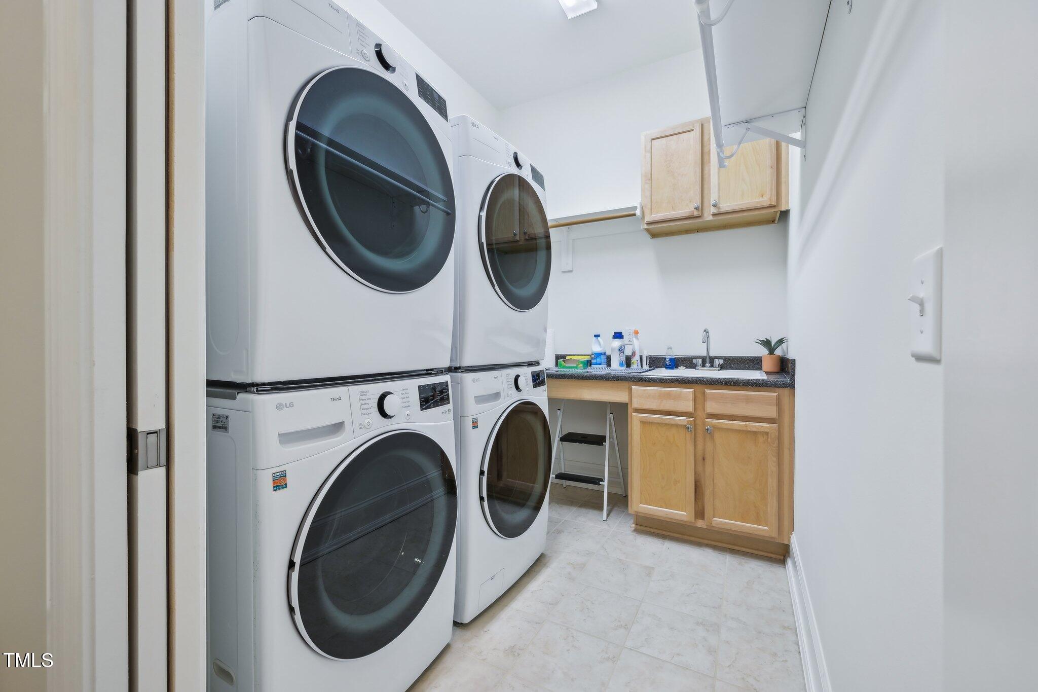 301 Kinsale Drive Durham, NC 27707 - Photo 31 of 68 a utility room with dryer and washer