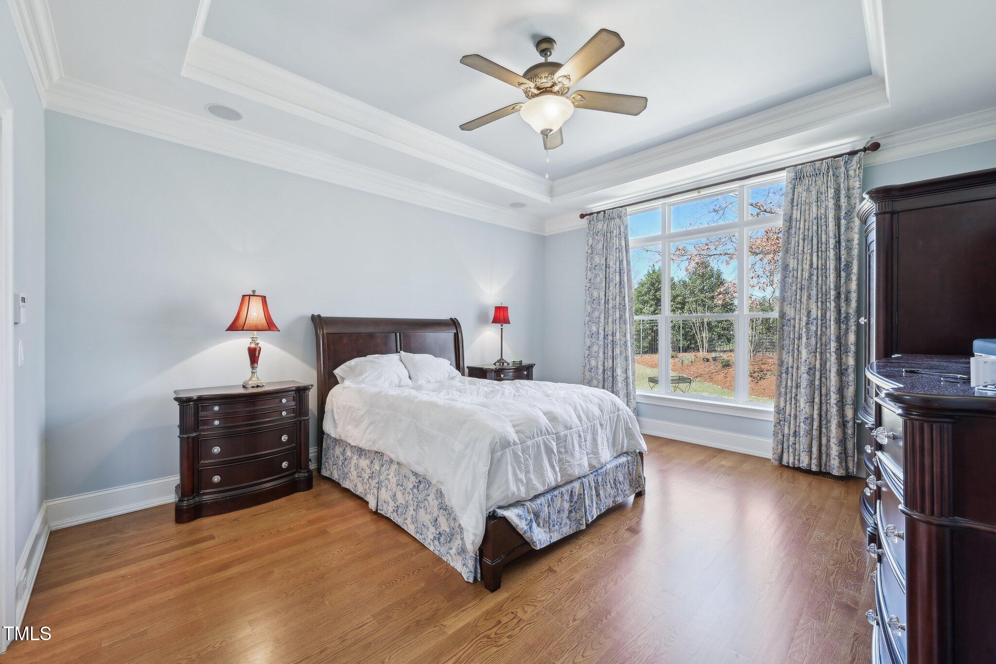 301 Kinsale Drive Durham, NC 27707 - Photo 33 of 68 a bedroom with a bed and a flat tv screen on dresser