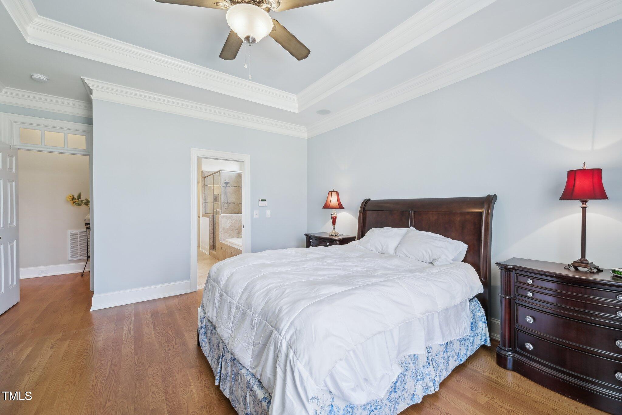 301 Kinsale Drive Durham, NC 27707 - Photo 34 of 68 a bedroom with bed and wooden floor