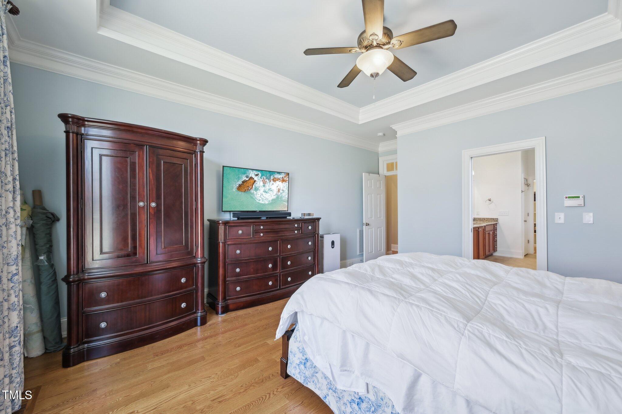 301 Kinsale Drive Durham, NC 27707 - Photo 35 of 68 a bedroom with a bed and a dresser