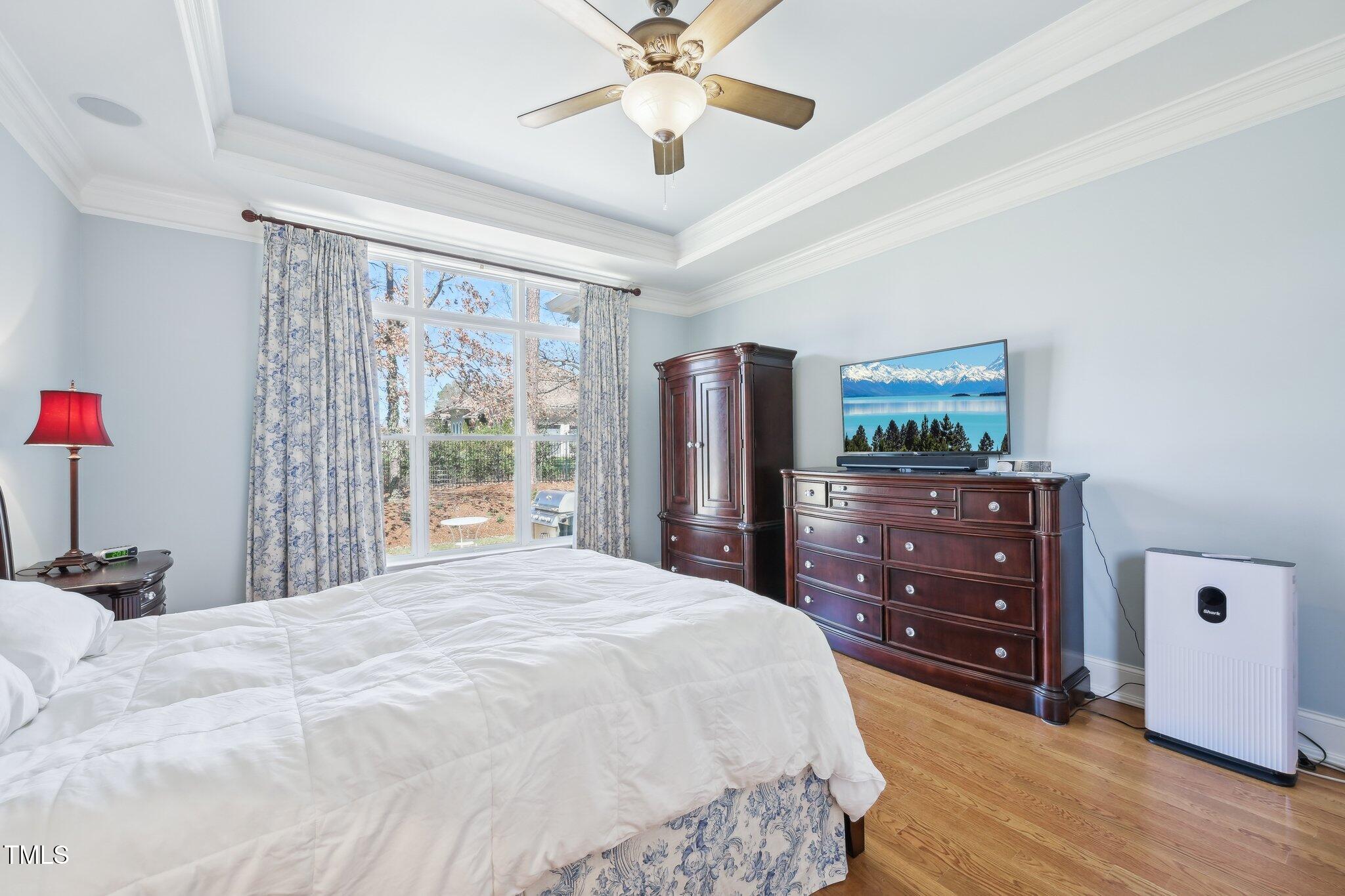 301 Kinsale Drive Durham, NC 27707 - Photo 36 of 68 a bedroom with a bed and a dresser