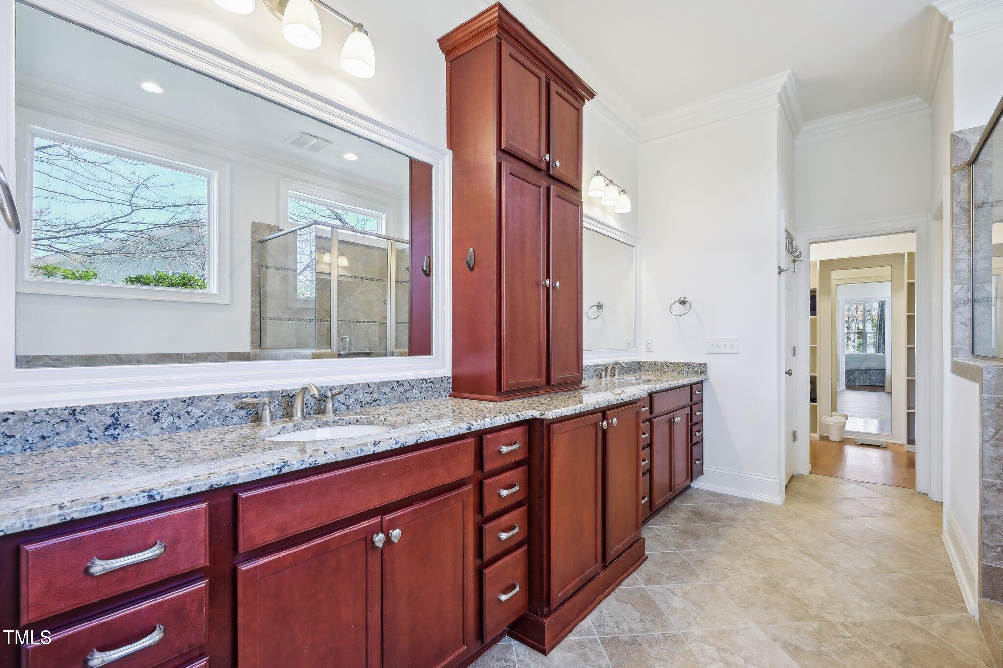 301 Kinsale Drive Durham, NC 27707 - Photo 38 of 68 a spacious bathroom with a granite countertop double vanity and a mirror