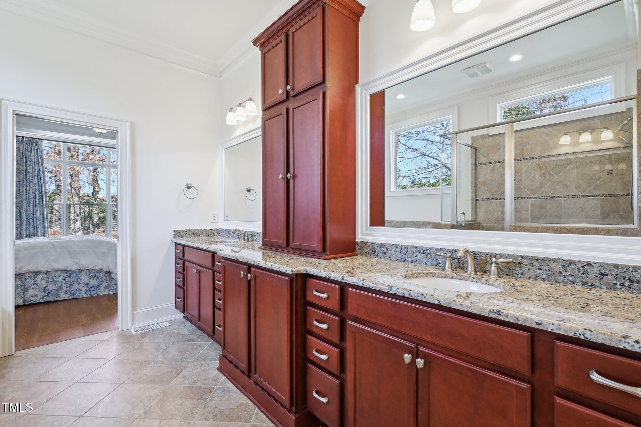 301 Kinsale Drive Durham, NC 27707 - Photo 41 of 68 a bathroom with a granite countertop double vanity sink and a bathtub