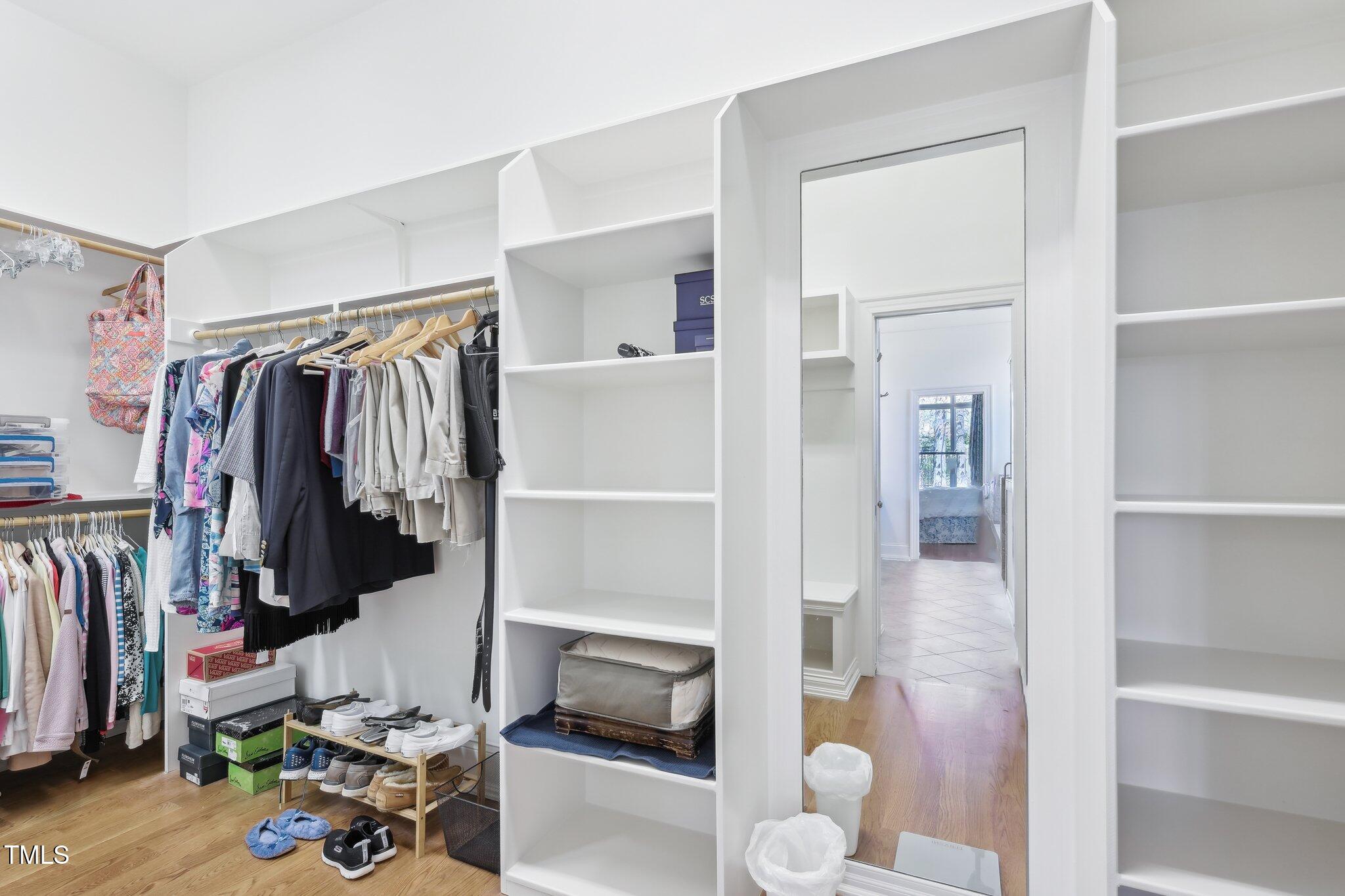 301 Kinsale Drive Durham, NC 27707 - Photo 42 of 68 a view of walk in closet with clothes and shoes