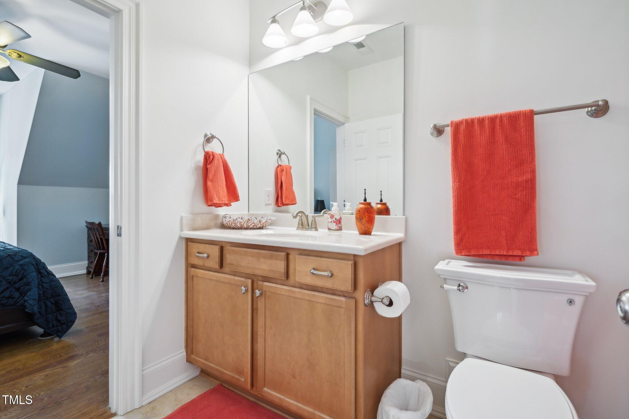 301 Kinsale Drive Durham, NC 27707 - Photo 44 of 68 a bathroom with a toilet sink and mirror