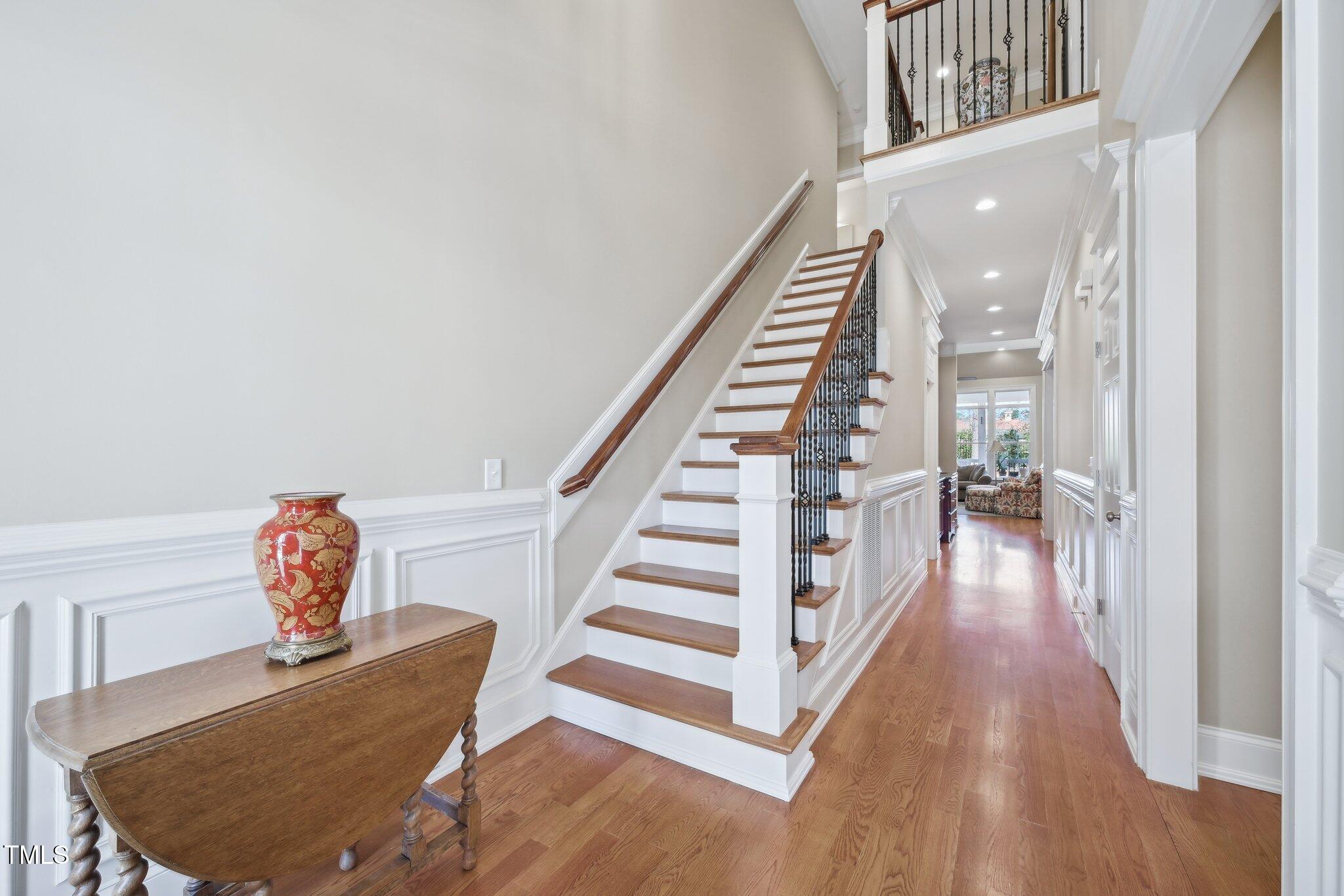 301 Kinsale Drive Durham, NC 27707 - Photo 4 of 68 a view of a hallway to a livingroom and stairs