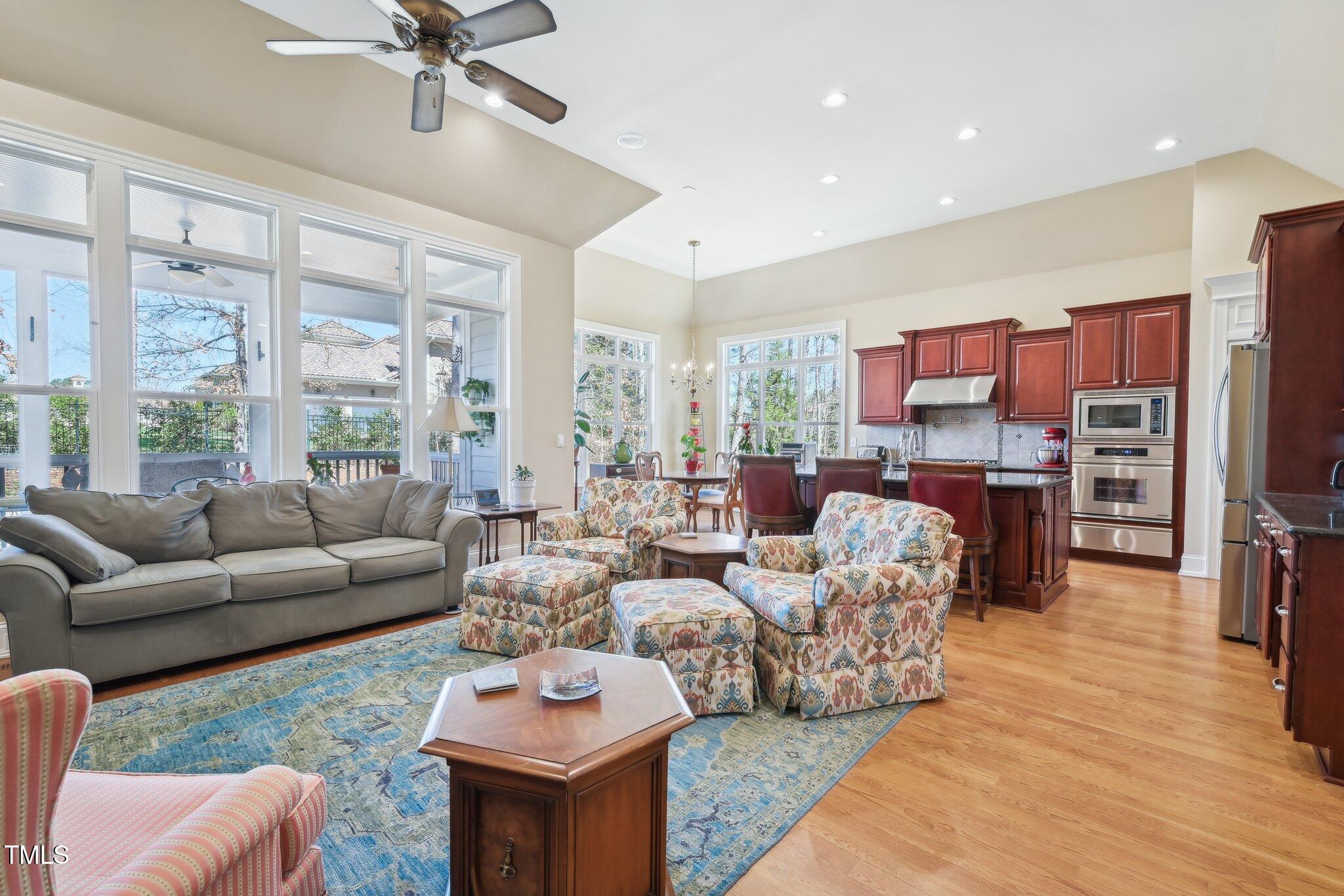 301 Kinsale Drive Durham, NC 27707 - Photo 5 of 68 a living room with furniture a large window and a flat screen tv