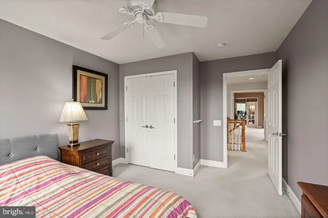 a bedroom with a bed and a lamp