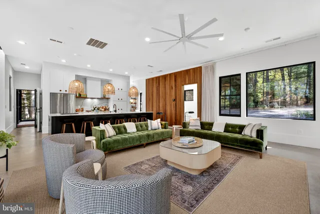 a view of a hallway with wooden floor and a cabinet