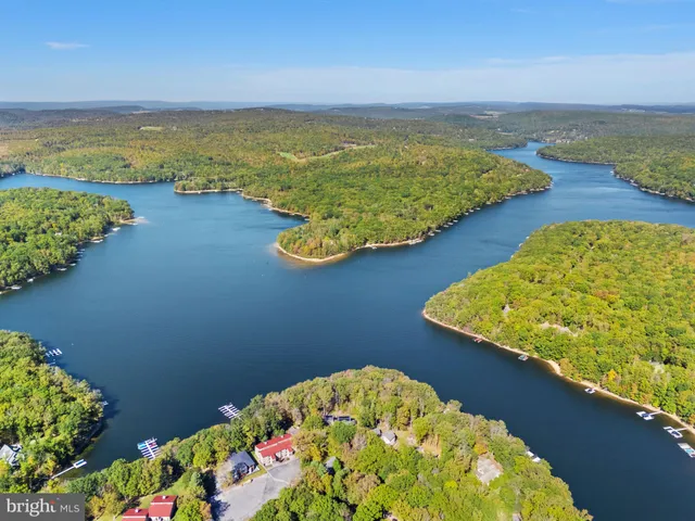 a view of a swimming pool with an outdoor space and seating area