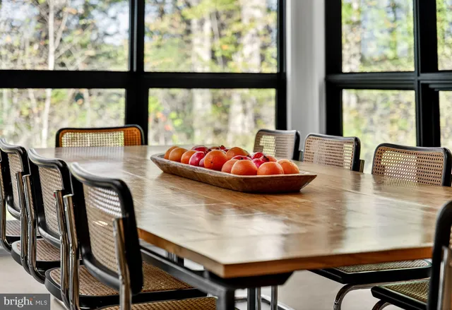 a view of a hallway with wooden floor and entryway
