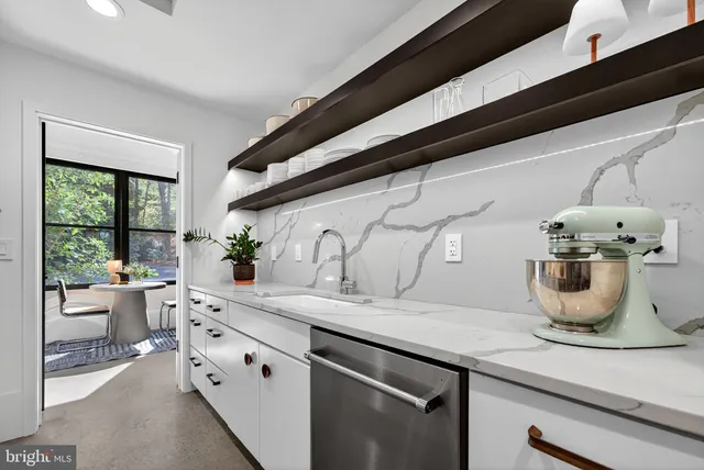 a work room with furniture and windows