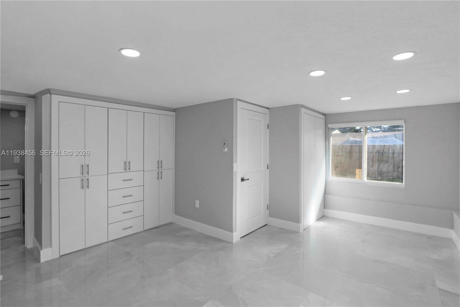 5730 Greene Street Hollywood, FL 33021 - Photo 13 of 27 an empty room with windows and closet