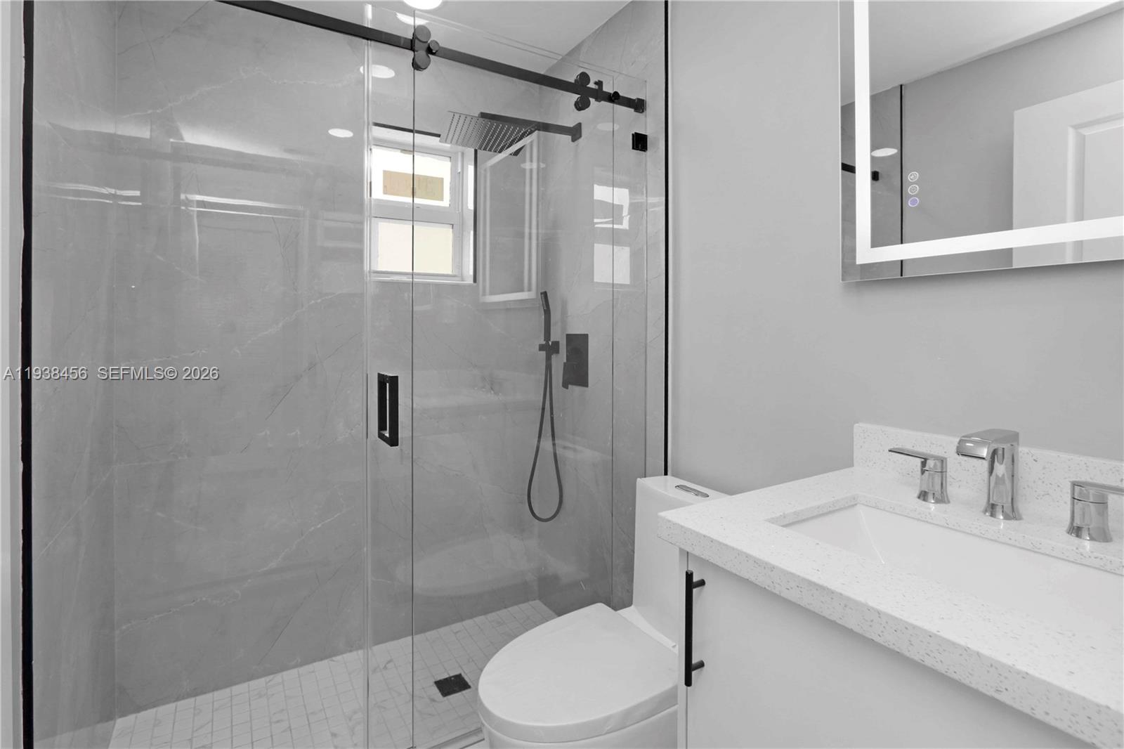 5730 Greene Street Hollywood, FL 33021 - Photo 15 of 27 a bathroom with a sink toilet and shower