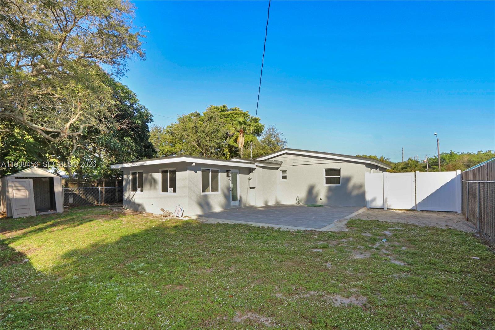 5730 Greene Street Hollywood, FL 33021 - Photo 22 of 27 a front view of a house with a yard