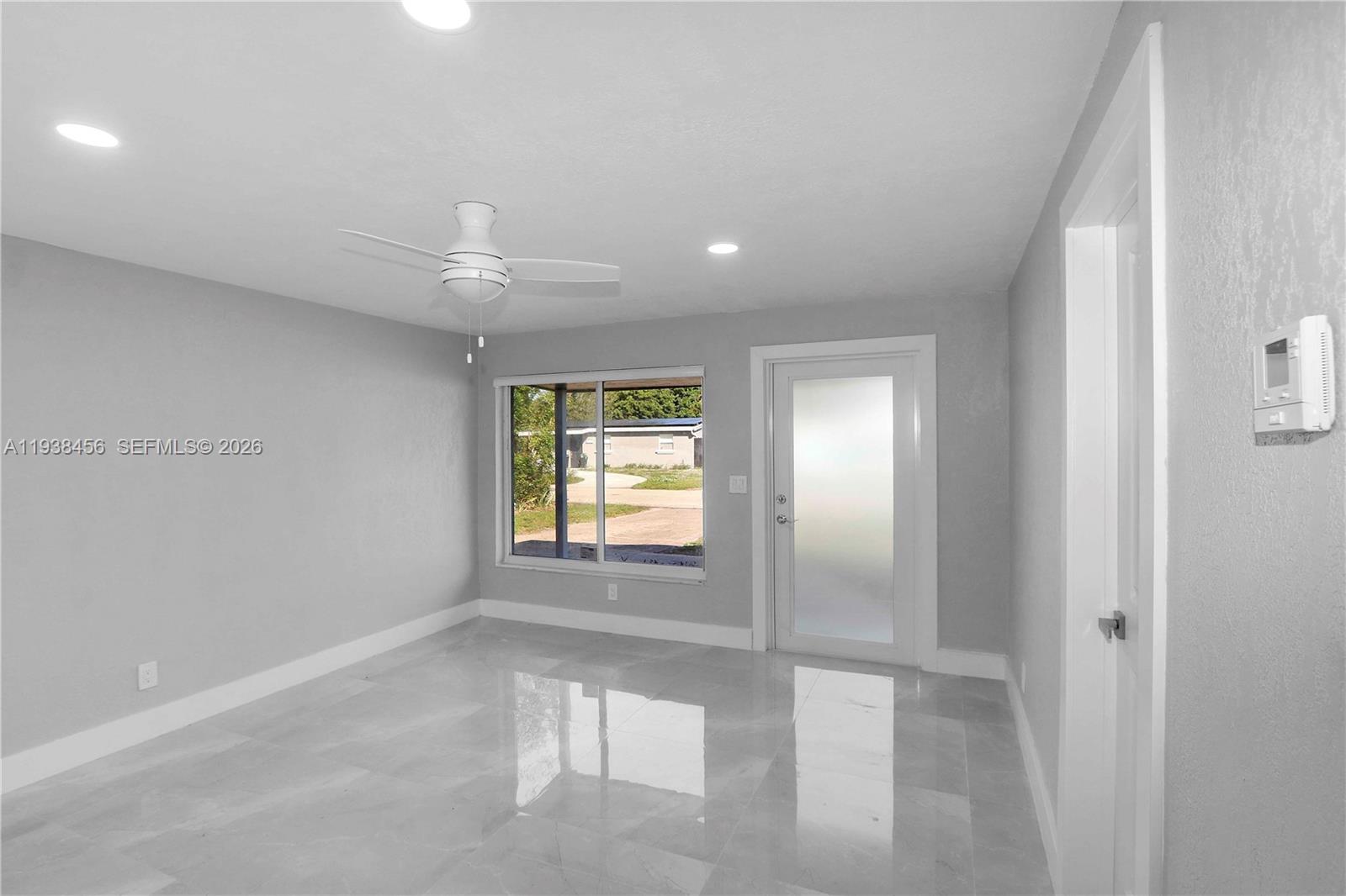 5730 Greene Street Hollywood, FL 33021 - Photo 7 of 27 a view of an empty room with a window