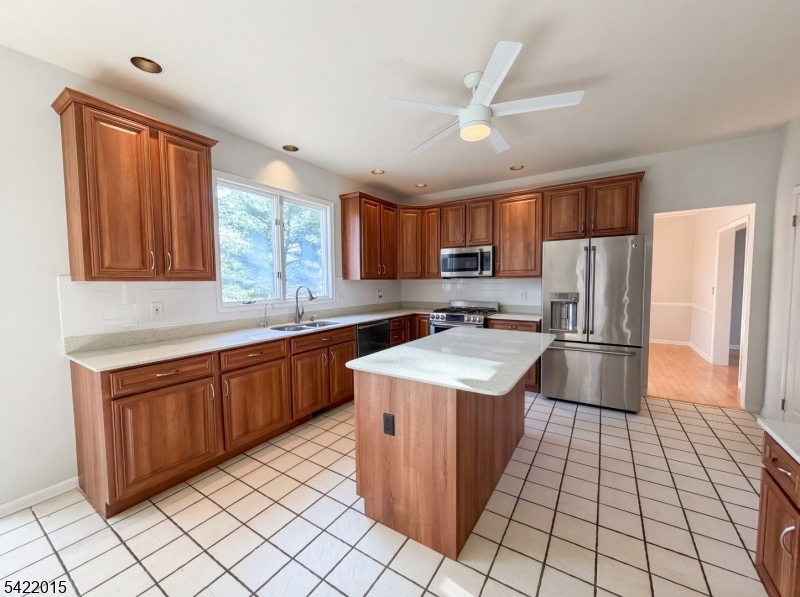 40 Glen Eagles Road Washington, NJ 07882 - Photo 2 of 38 a kitchen with stainless steel appliances granite countertop a sink stove refrigerator and cabinets