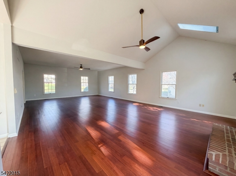 40 Glen Eagles Road Washington, NJ 07882 - Photo 22 of 38 a view of an empty room with wooden floor and a window