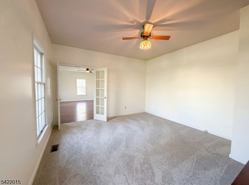 40 Glen Eagles Road Washington, NJ 07882 - Photo 24 of 38 an empty room with fan and windows