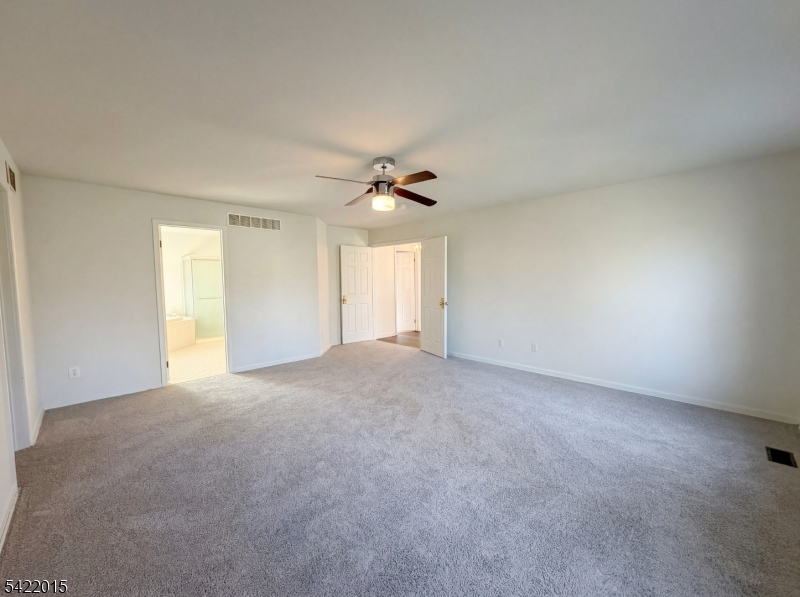 40 Glen Eagles Road Washington, NJ 07882 - Photo 26 of 38 a view of a livingroom with a ceiling fan and window