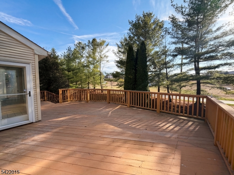 40 Glen Eagles Road Washington, NJ 07882 - Photo 28 of 38 a view of backyard with large trees and wooden fence