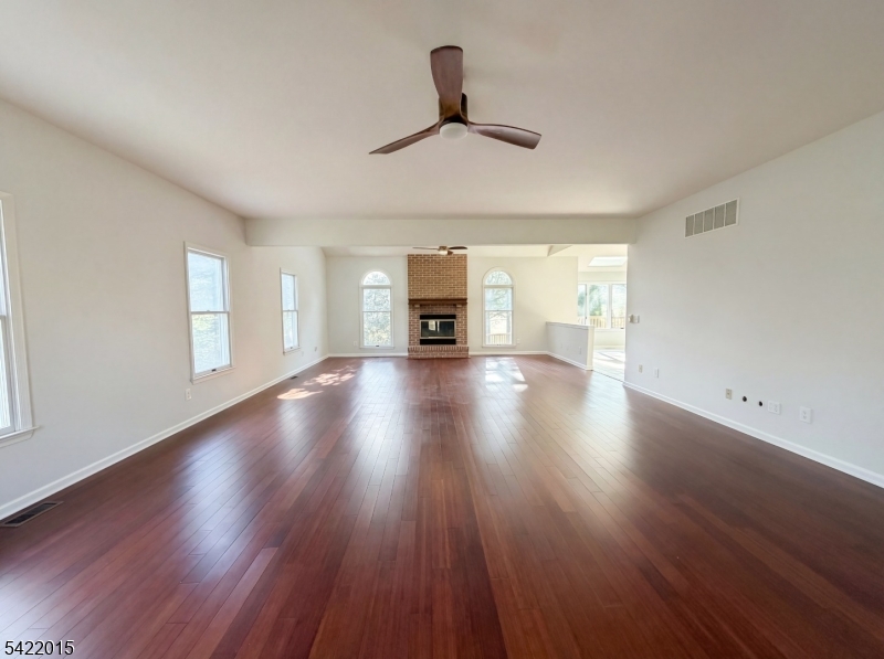 40 Glen Eagles Road Washington, NJ 07882 - Photo 3 of 38 a view of a livingroom with wooden floor fireplace and window