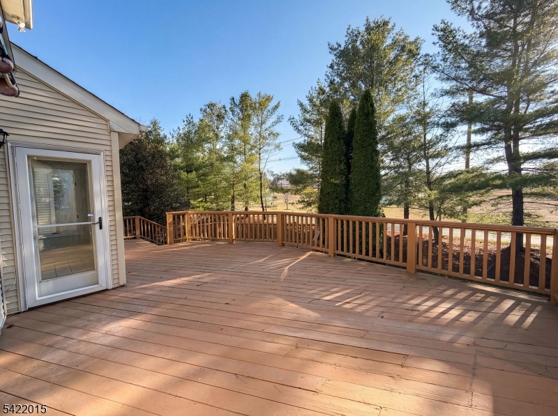 40 Glen Eagles Road Washington, NJ 07882 - Photo 35 of 38 a view of backyard with large trees and wooden fence