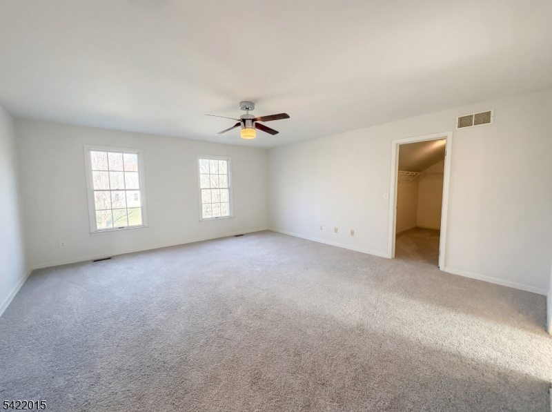 40 Glen Eagles Road Washington, NJ 07882 - Photo 4 of 38 a view of an empty room with a window