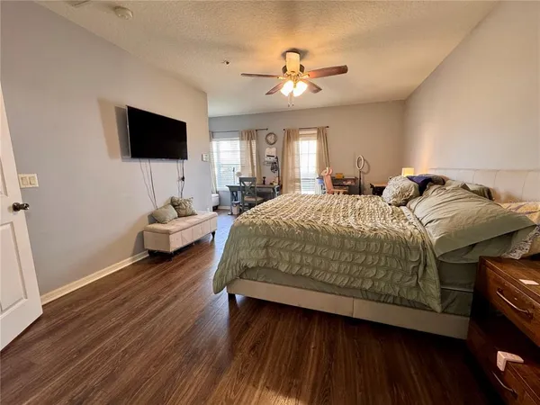a bathroom with a tub double vanity sink and a mirror