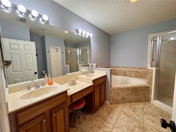 a bathroom with a tub and a toilet