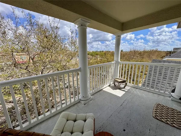 a view of a workspace with furniture and wooden floor