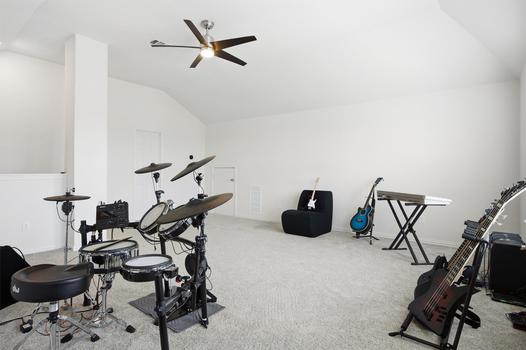 192 Raptor Beak Way Cedar Creek, TX 78612 - Photo 31 of 38 Spacious room featuring vaulted ceilings, light neutral carpeting, and a ceiling fan with integrated lighting