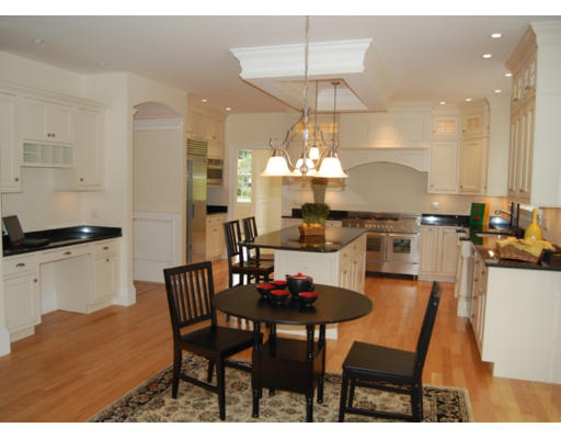 3 Graham Road Lexington, MA 02420 - Photo 7 of 26 a view of a dining room with furniture a chandelier and kitchen view