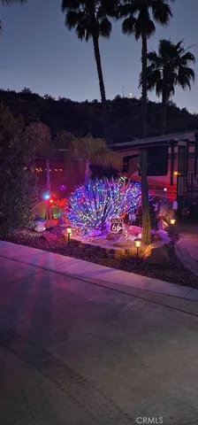 a front view of a house with yard and sitting area