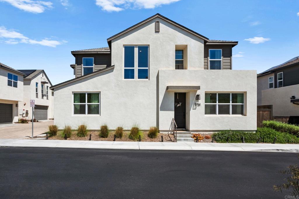1751 Whitmore Loop Chula Vista, CA 91913 - Photo 1 of 44 a front view of a house with a yard