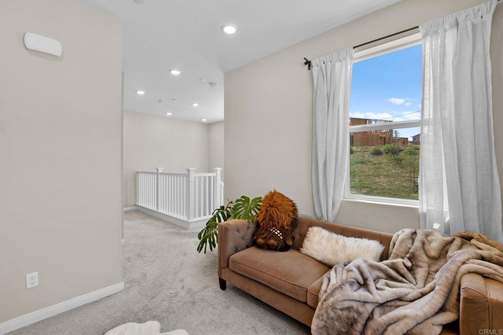 1751 Whitmore Loop Chula Vista, CA 91913 - Photo 13 of 44 a living room with furniture and a large window