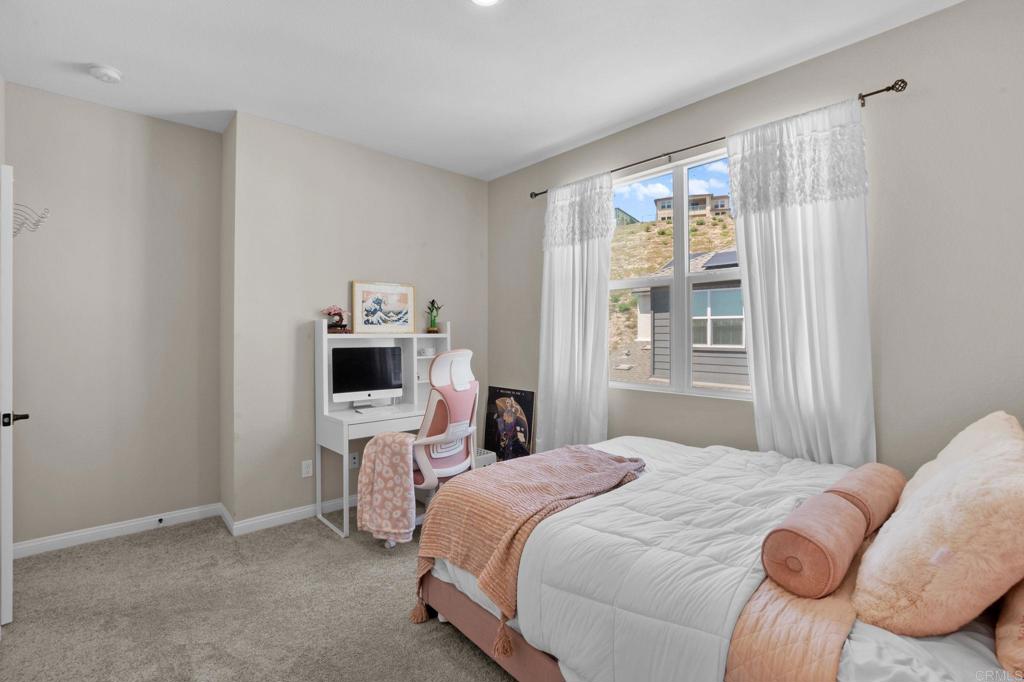1751 Whitmore Loop Chula Vista, CA 91913 - Photo 15 of 44 a bedroom with a bed wooden floor and window