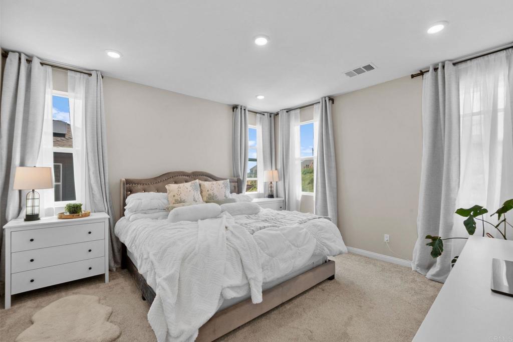 1751 Whitmore Loop Chula Vista, CA 91913 - Photo 19 of 44 a bedroom with a bed and a dresser