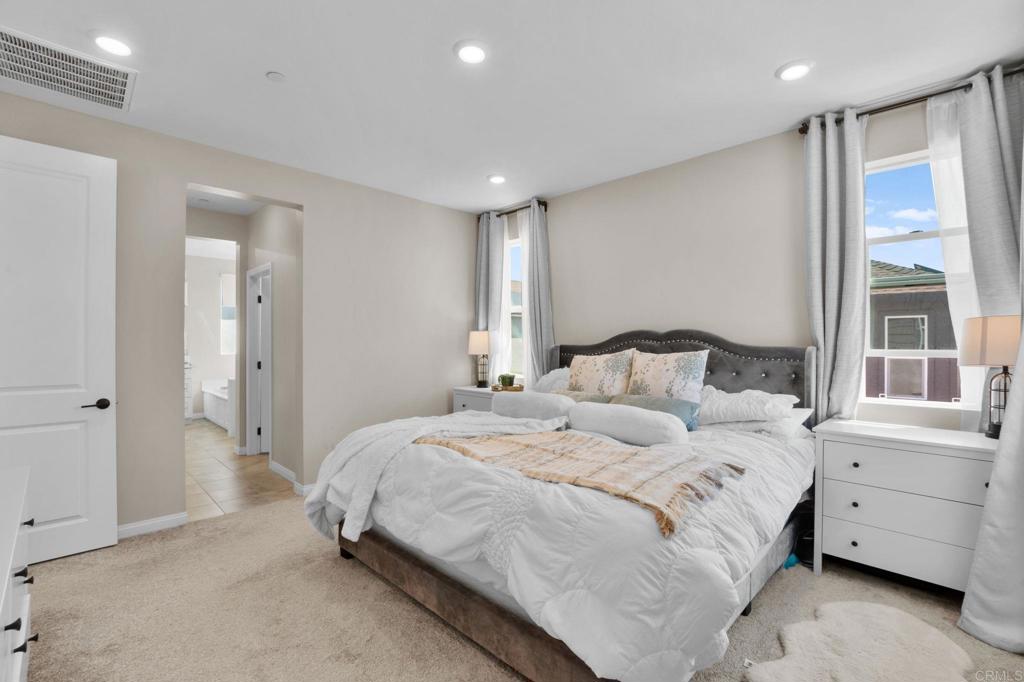 1751 Whitmore Loop Chula Vista, CA 91913 - Photo 20 of 44 a bedroom with a bed and a window