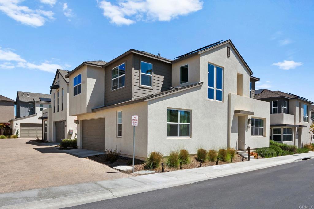 1751 Whitmore Loop Chula Vista, CA 91913 - Photo 2 of 44 a front view of a house with a road