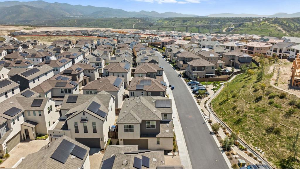 1751 Whitmore Loop Chula Vista, CA 91913 - Photo 34 of 44 an aerial view of a house with a mountain