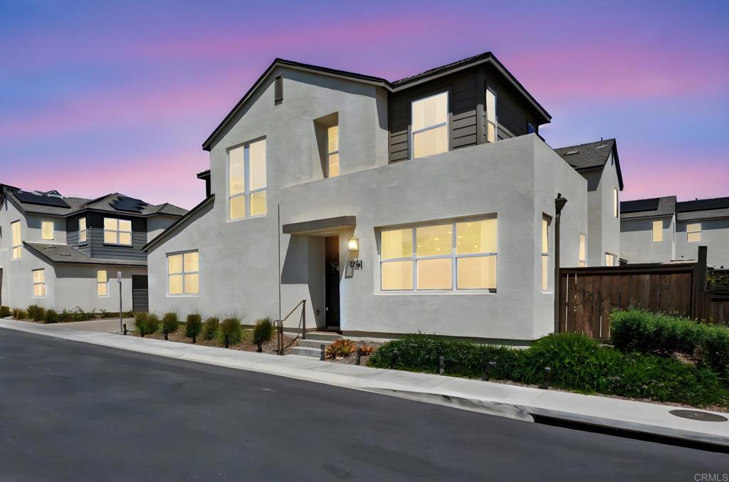 1751 Whitmore Loop Chula Vista, CA 91913 - Photo 41 of 44 a front view of a house with a yard and garage