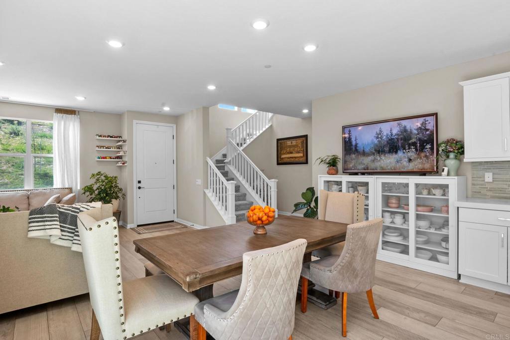 1751 Whitmore Loop Chula Vista, CA 91913 - Photo 7 of 44 a living room with furniture kitchen view and a wooden floor