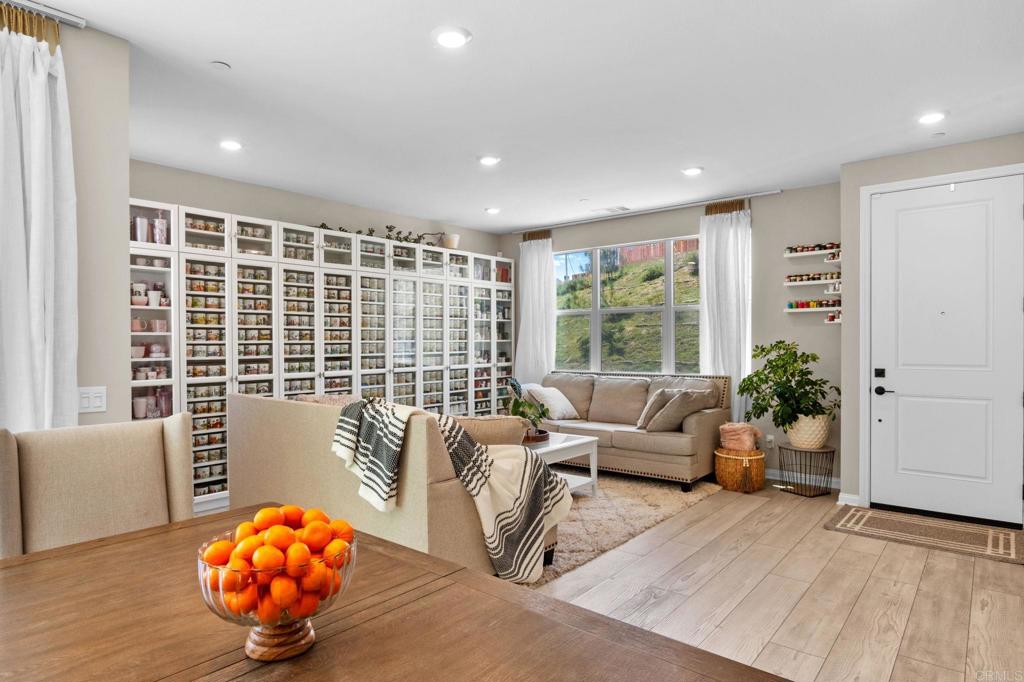 1751 Whitmore Loop Chula Vista, CA 91913 - Photo 8 of 44 a living room with furniture and a floor to ceiling window