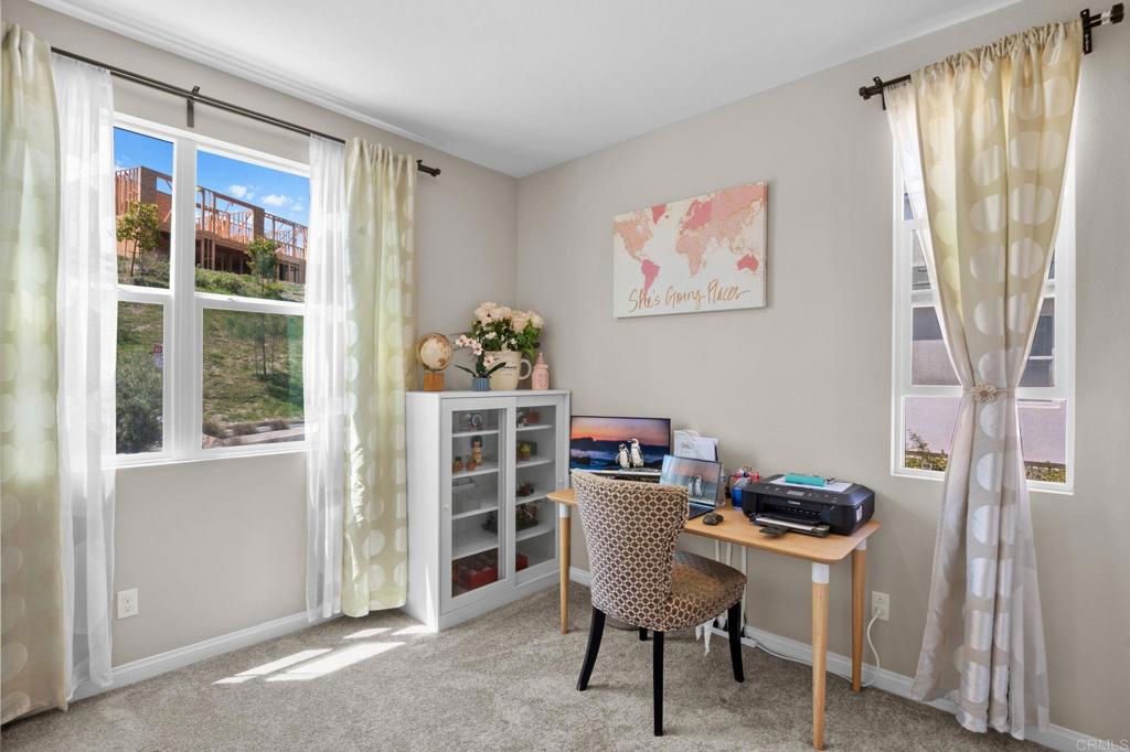 1751 Whitmore Loop Chula Vista, CA 91913 - Photo 9 of 44 a view of a workspace with furniture and a window