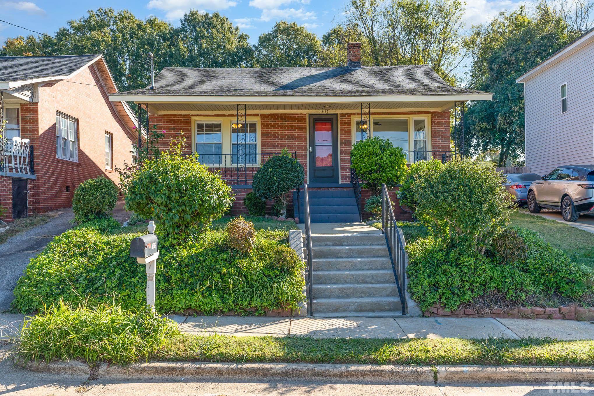 1415 Garner Road Raleigh, NC 27610 - Photo 1 of 15 a view of a house with a yard