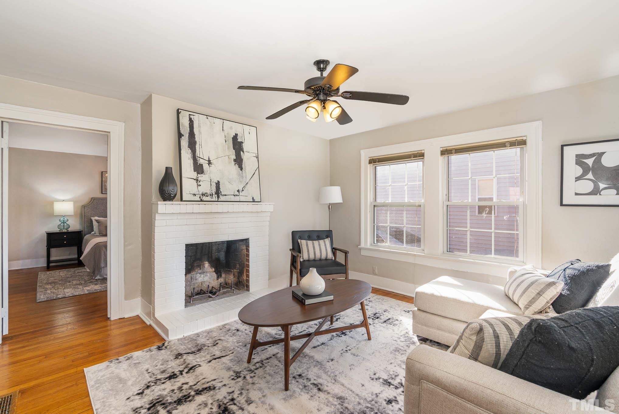 1415 Garner Road Raleigh, NC 27610 - Photo 4 of 15 a living room with furniture and a fireplace