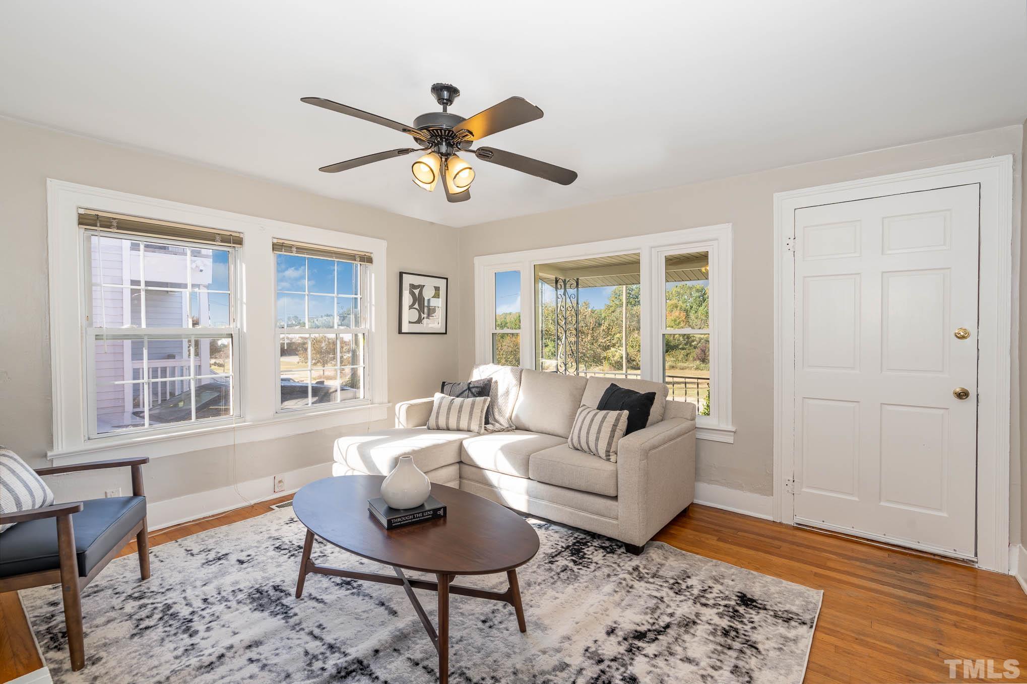 1415 Garner Road Raleigh, NC 27610 - Photo 5 of 15 a living room with furniture and a large window