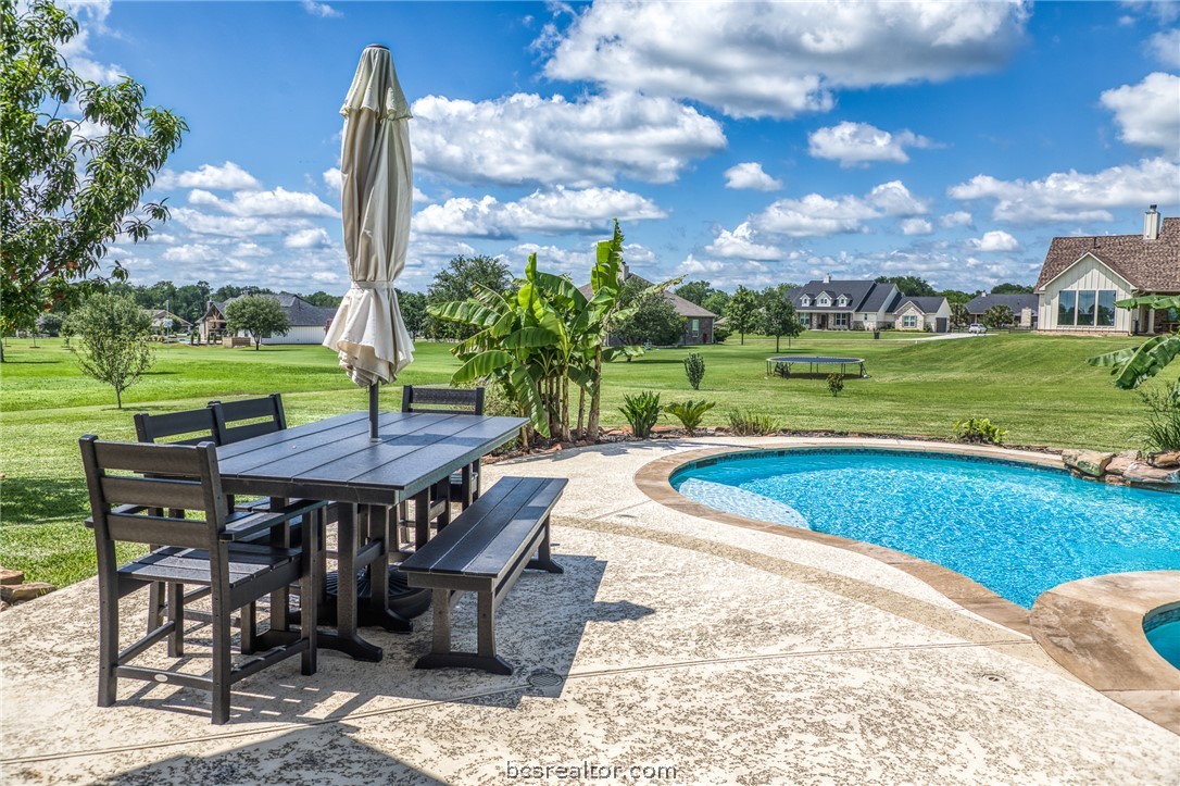 586 Ruby Drive Bellville, TX 77418 - Photo 35 of 50 a view of a swimming pool and outdoor seating