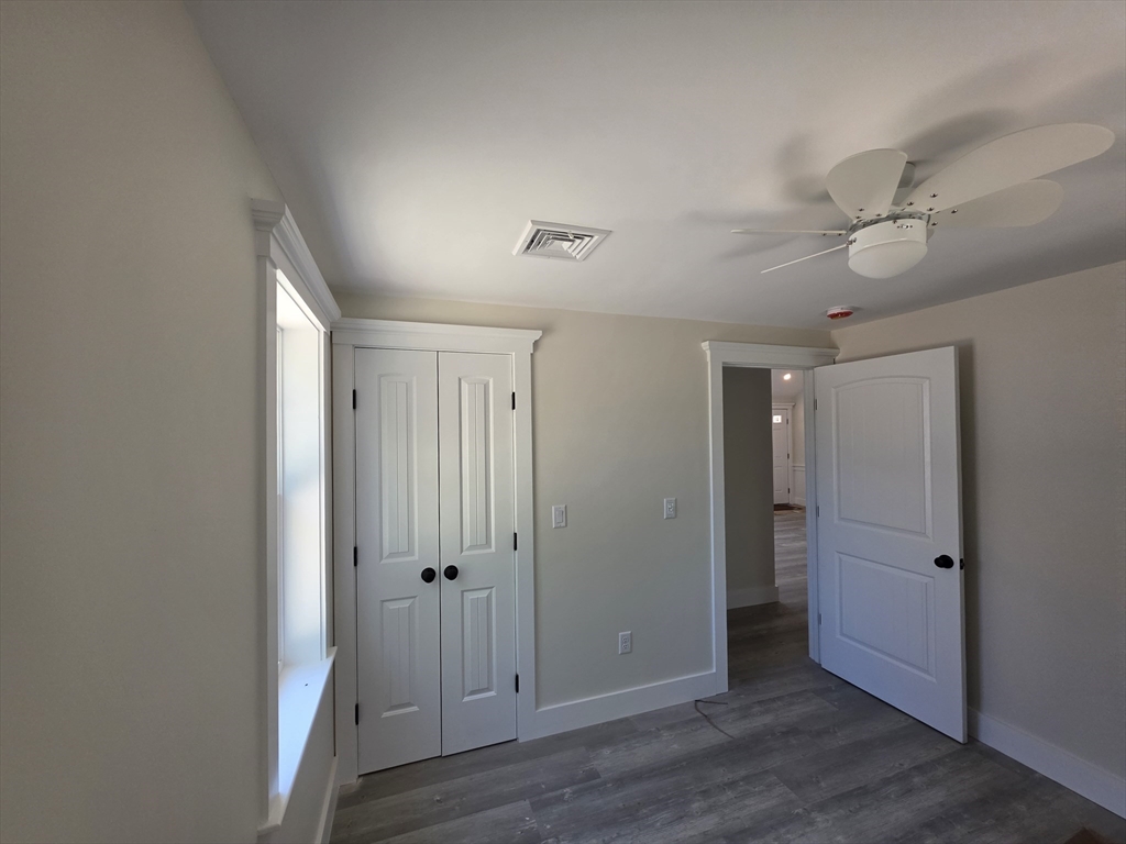87 Acapesket Road, Unit 2A Falmouth, MA 02536 - Photo 12 of 17 a view of a hallway with wooden floor
